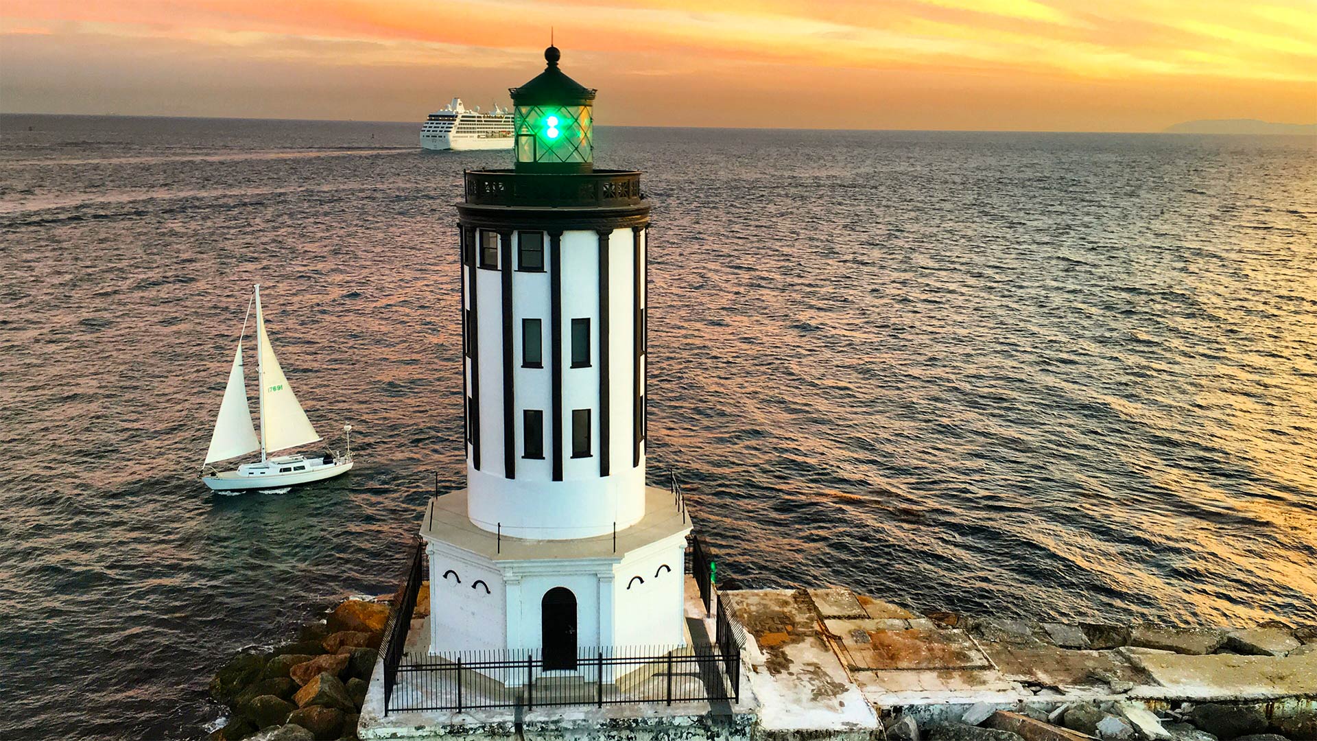 Angel's Gate Lighthouse in San Pedro harbor. Photo taken at sunset by Celebrity Helicopter Tours.