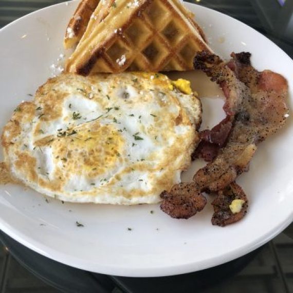BUTTER BELGIUM WAFFLES WITH EGG OVER HARD, AND BACON